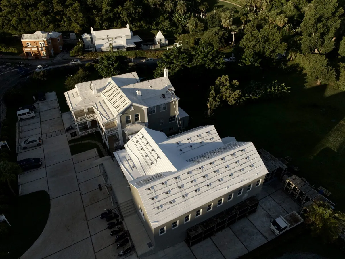 A commercial building in Bermuda with its roof restored by AES RoofTech, seen from the air