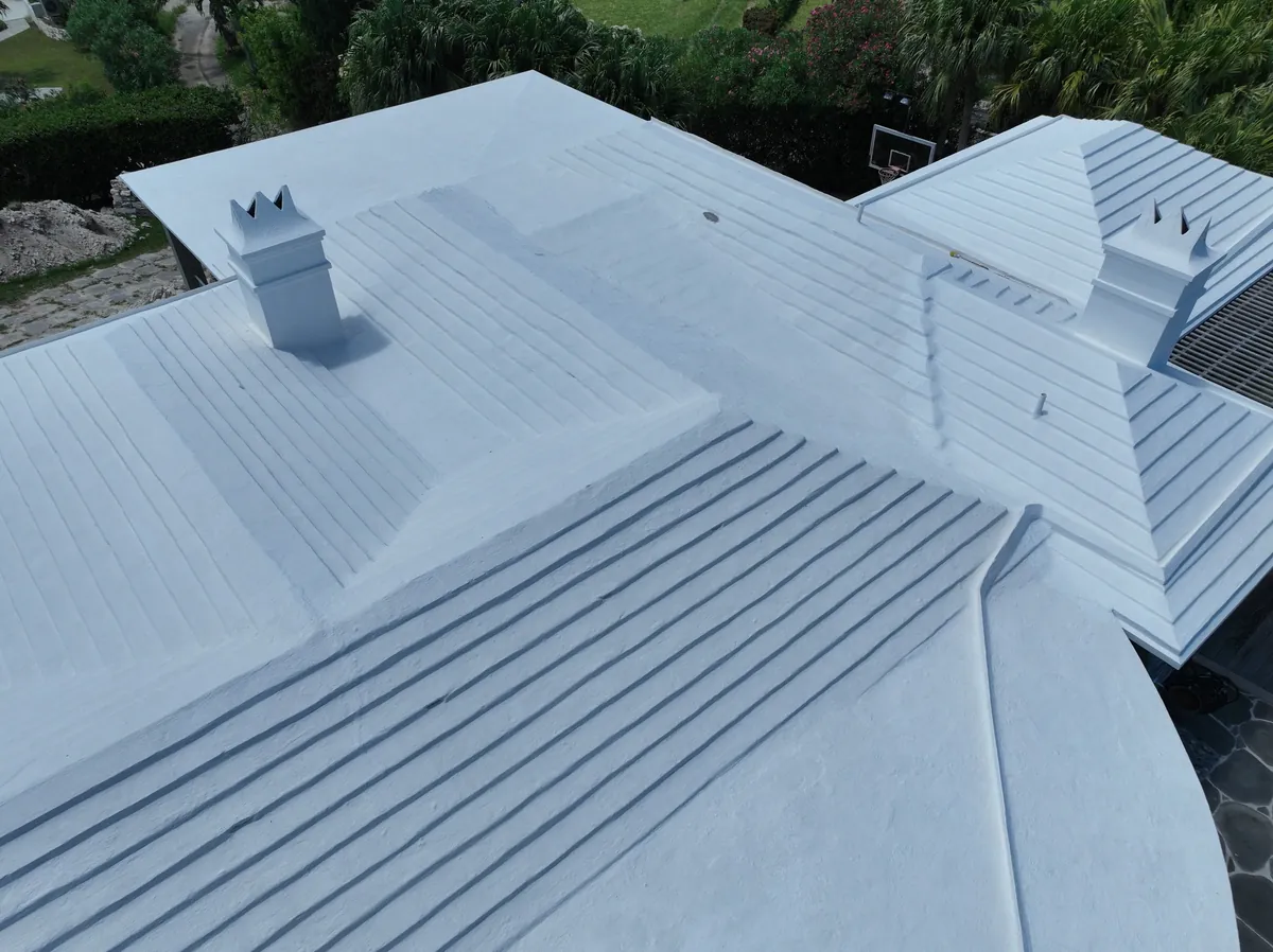 A white Bermuda roof restored by AES RoofTech, sealed and coated edge to edge