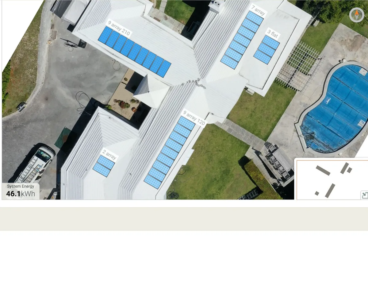 Enphase Enlighten array view of an AES solar installation in Paget, Bermuda: blue panel tiles with production over the drone image of the roof