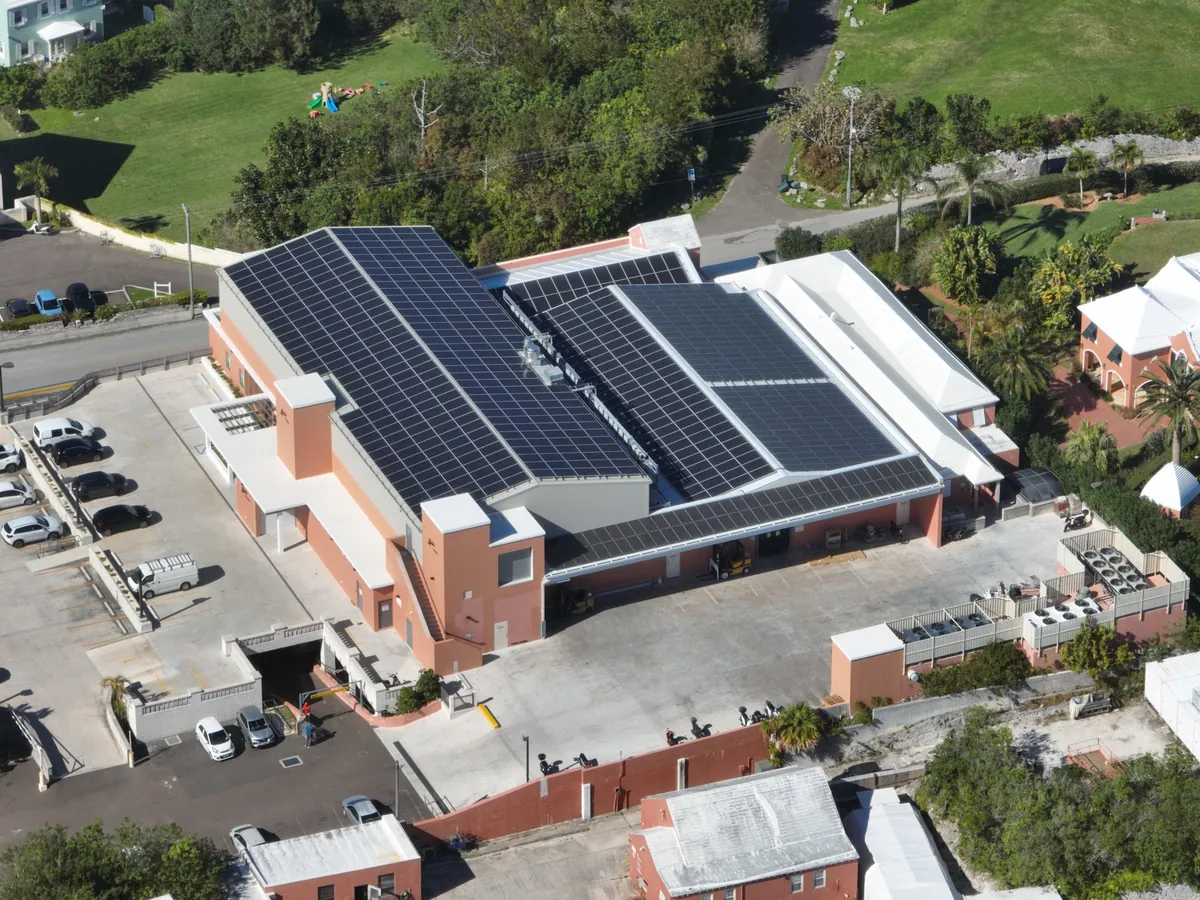 Solar panels across the gabled roofs of Lindo's in Devonshire, Bermuda, seen from the air