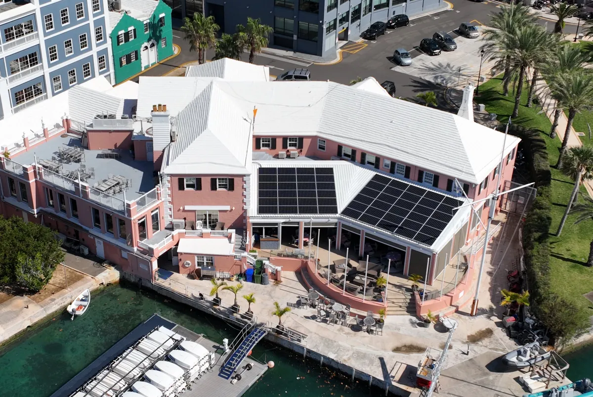 Solar panels on the Royal Bermuda Yacht Club clubhouse roofs above the marina, Hamilton