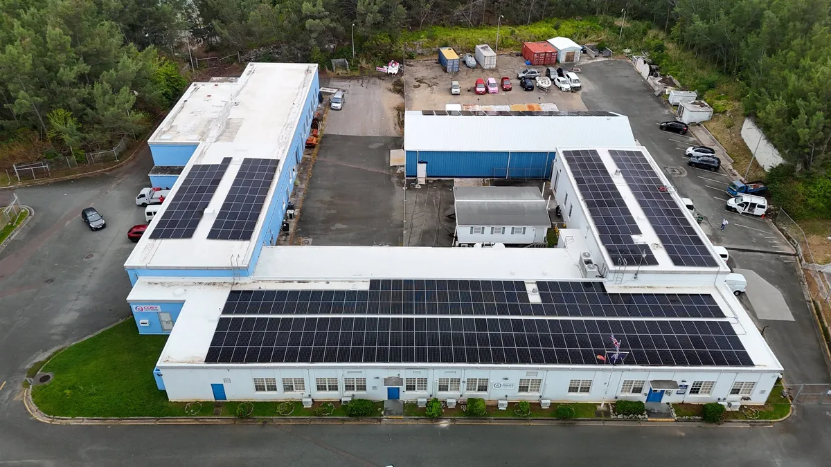 The Southside Police Station in St David's, Bermuda, with solar panels on every wing, seen from the air